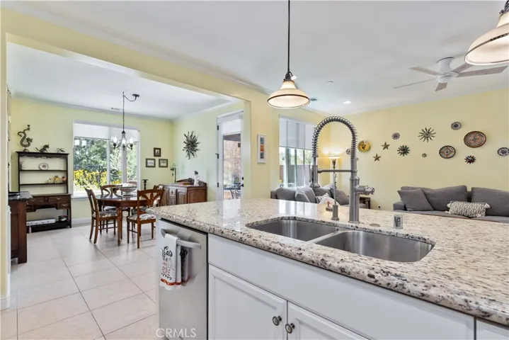 Sink in Kitchen Island looking out to the living room and dining area.