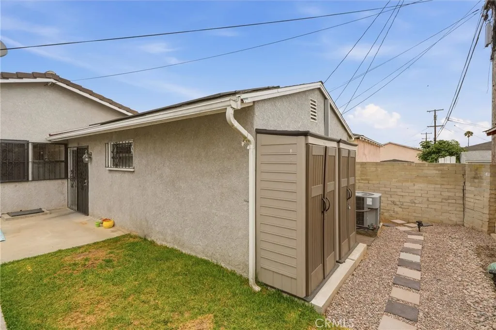 Separate entrance into 4th bedroom/ADU with additional storage in the backyard.