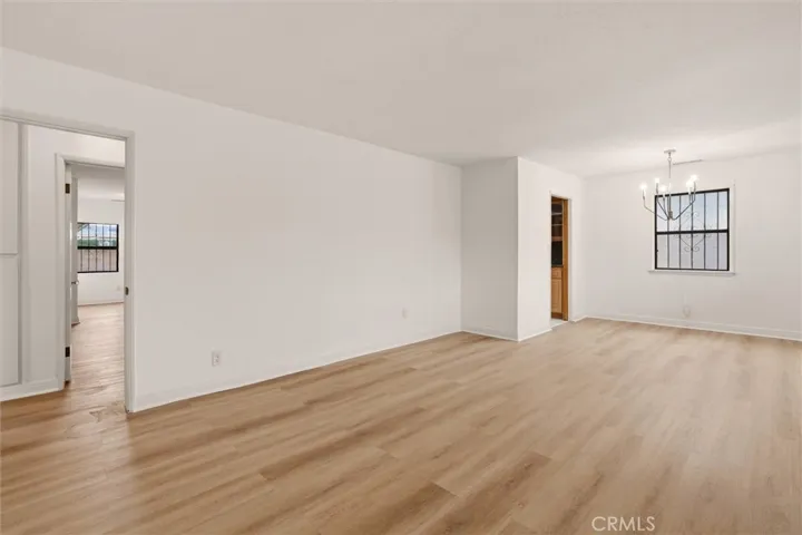 Sun-filled living room with new flooring and paint.