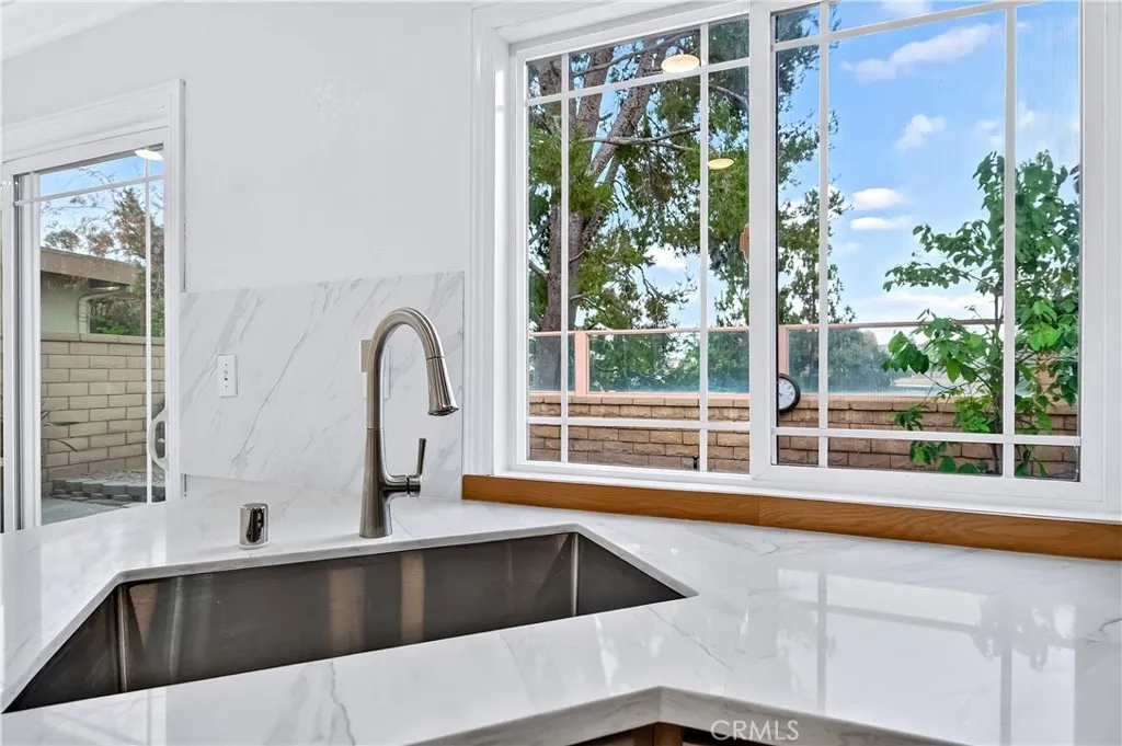 Kitchen with view of backyard