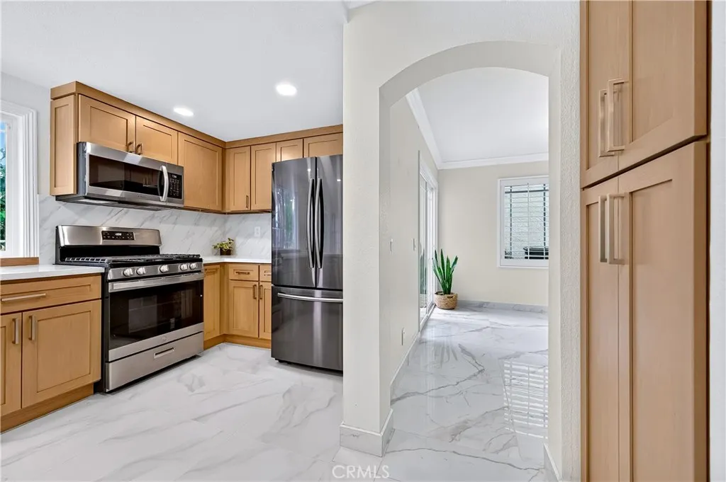 View of kitchen, pantry and hallway