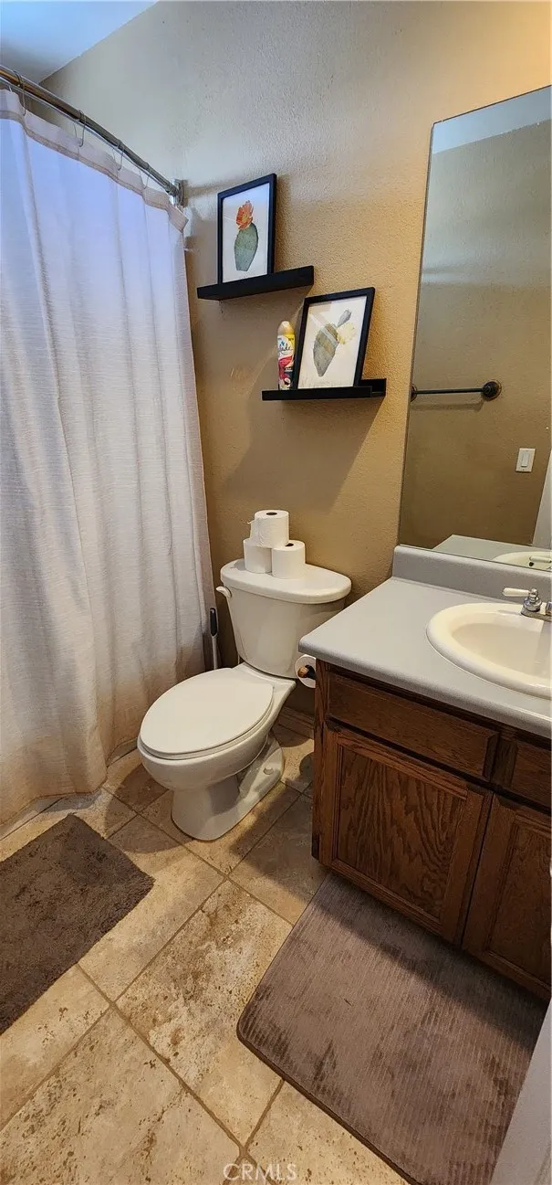 Upstairs guest bathroom has tub/shower combo
