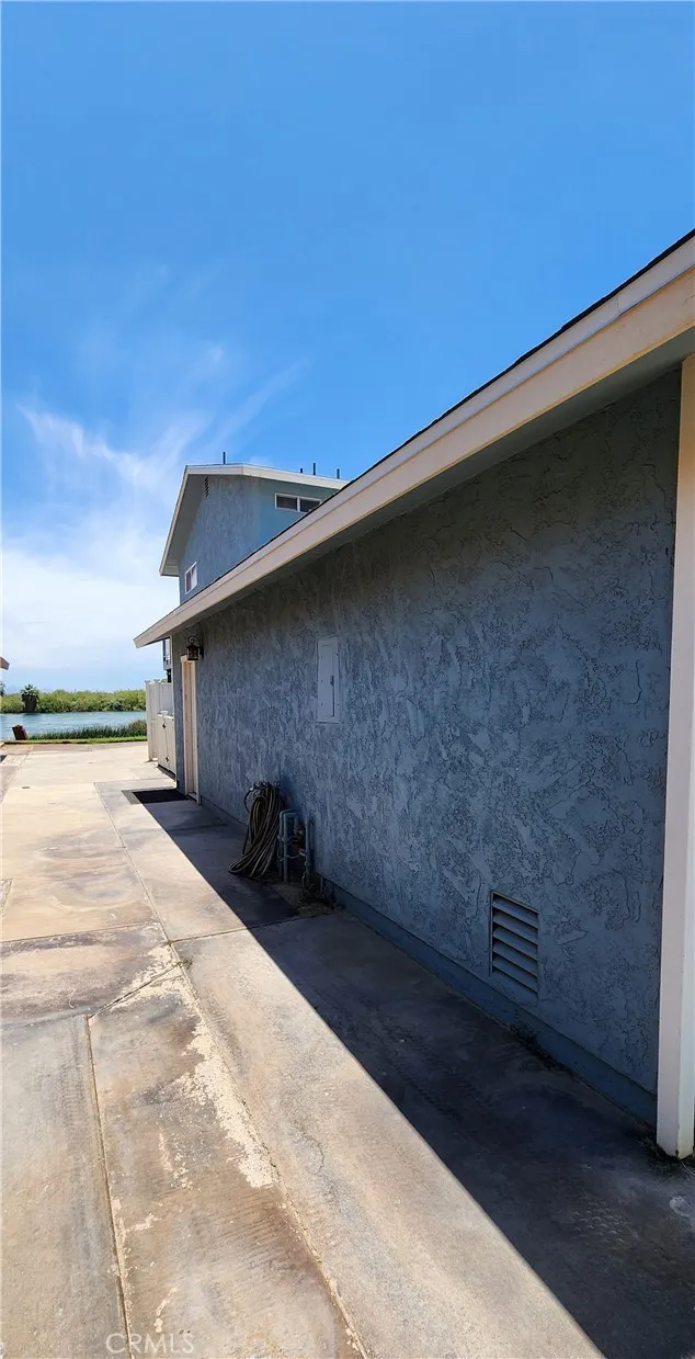 Side of the house facing toward the water