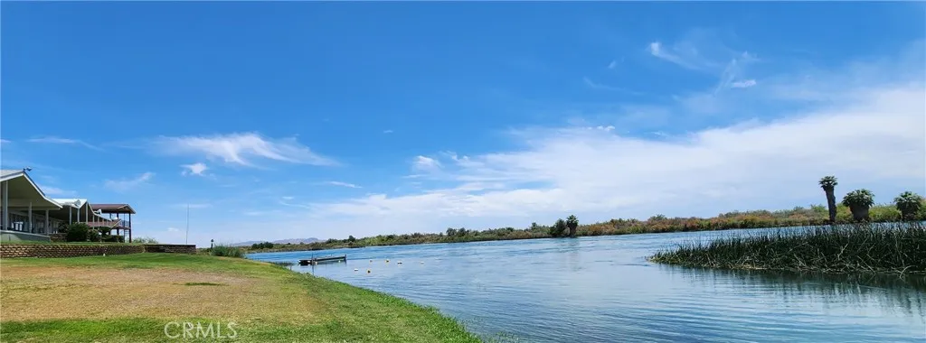 The house sits at the end of the lagoon, where it meets the main river