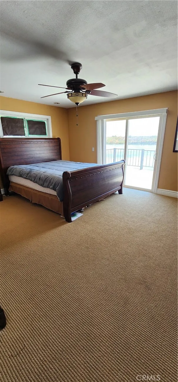 Primary bedroom has ensuite bathroom and slider to upstairs balcony