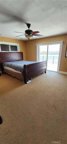Primary bedroom has ensuite bathroom and slider to upstairs balcony
