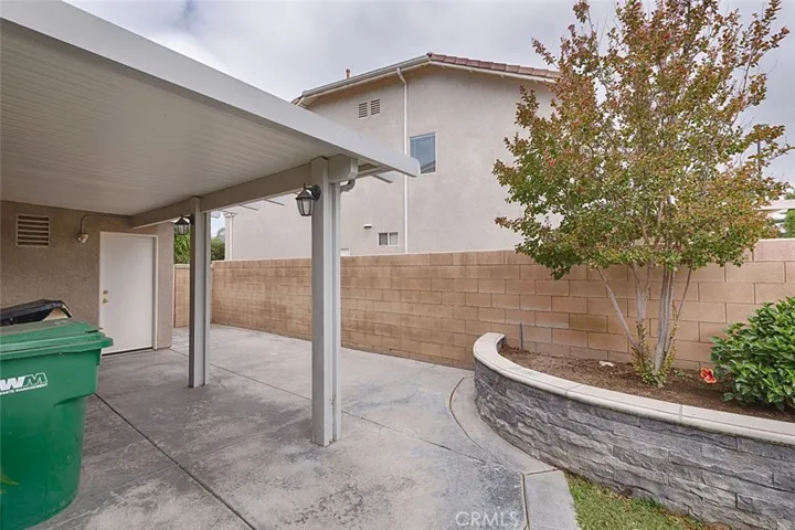 Another patio cover leads to garage door