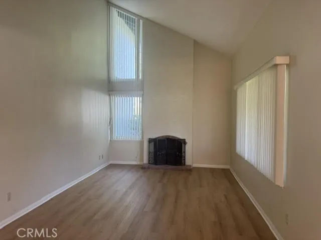 Formal Living Room with Vaulted Ceilings and Fireplace