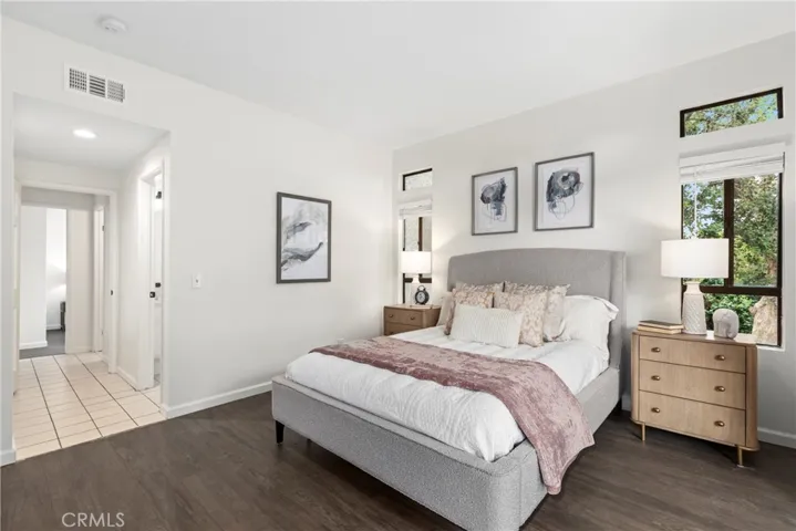 Primary Bedroom with closets and slider to the oversized balcony