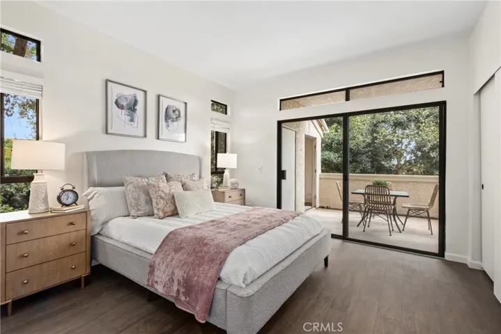 Primary Bedroom with closets and slider to the oversized balcony