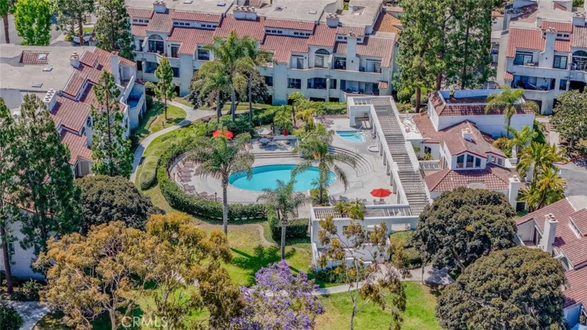 aerial view of Cabo Del Mar. Tennis court, pool, jacuzzi, clubhouse and gated.