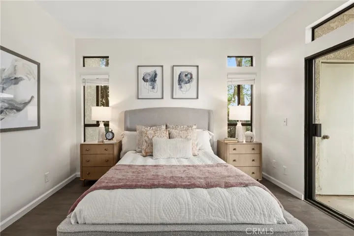Primary Bedroom with closets and slider to the oversized balcony