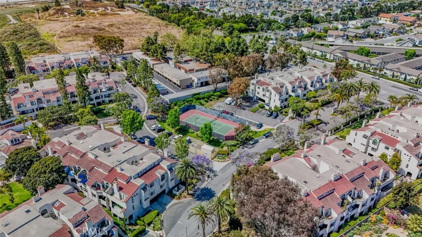 aerial view of Cabo Del Mar. Tennis court, pool, jacuzzi, clubhouse and gated.