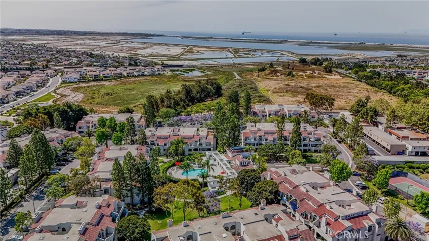 aerial view of Cabo Del Mar. Tennis court, pool, jacuzzi, clubhouse and gated.