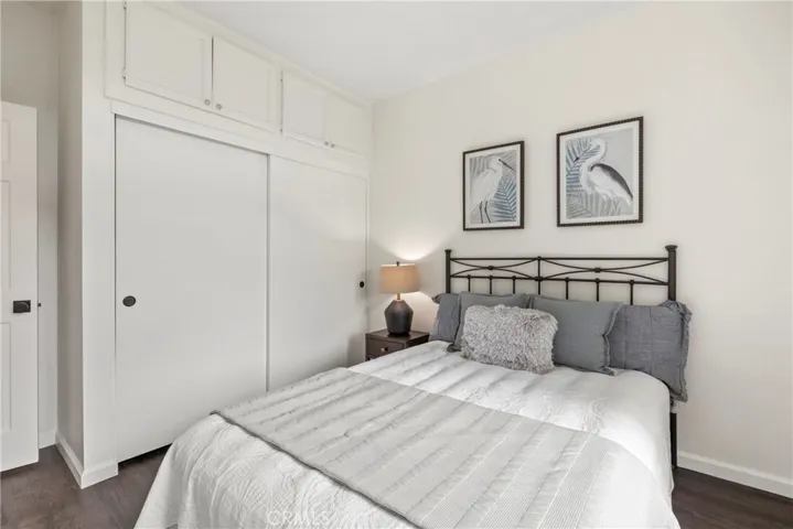 bedroom with closet and treetop views