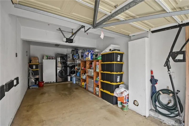 Detached garage , few steps to unit, stacked washer/dryer included