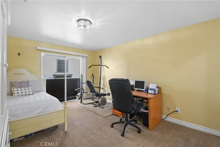Master bedroom with sliding door that opens to the balcony, and has walk in closet