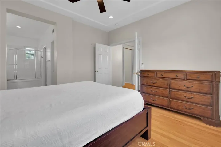 primary bedroom with ceiling fan
