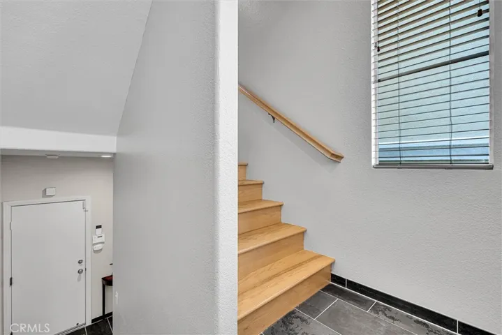 view from entry to landing and stairs to entertaining level.