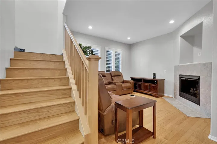 view from family room toward living room and stairway to upstairs