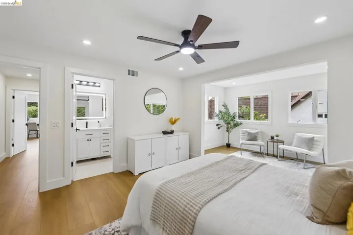 Bedroom featuring vinyl plank flooring and a contemporary ceiling fan