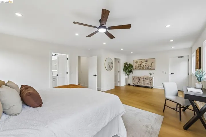 Spacious interior featuring vinyl plank flooring, recessed lighting, and a modern ceiling fan