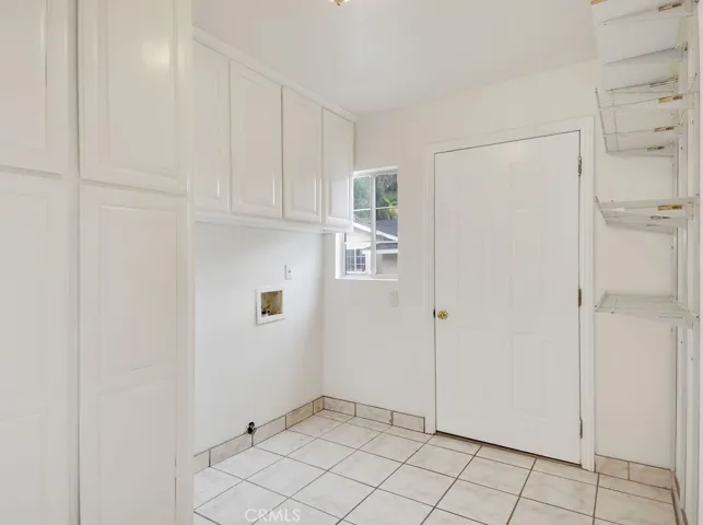 Front House laundry room with back exit door