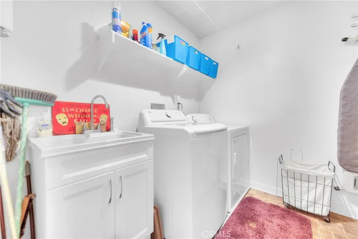 Laundry Room & Wash Sink.  Storage shelves.
