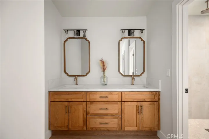 Primary bathroom with dual vanity sinks