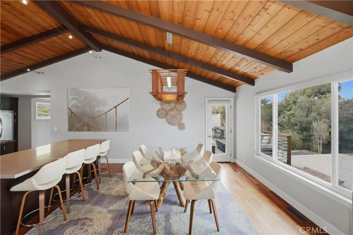 The formal dining is anchored by the large west facing windows to enjoy the view by day and gorgeous sunsets as the evening approaches.