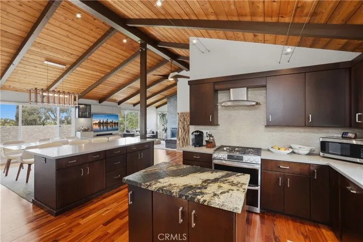 The leathered granite  topped island inspires creativity but also allows you to have appliances and utensils at your fingertips.