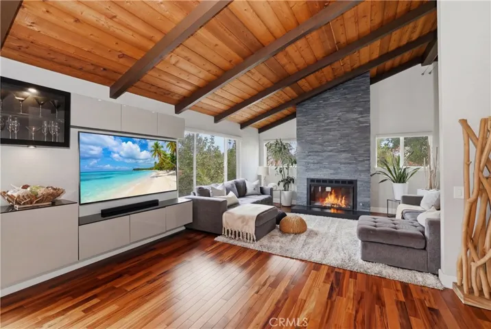 Soaring ceilings, the open concept and views are breathtaking as you enter this home.