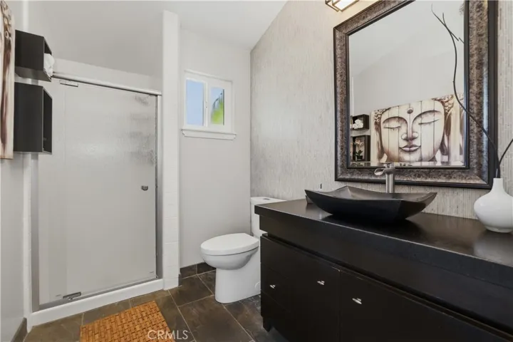 Each bathroom has custom touches to impress. Slate floors....basalt sink .... so elegant.