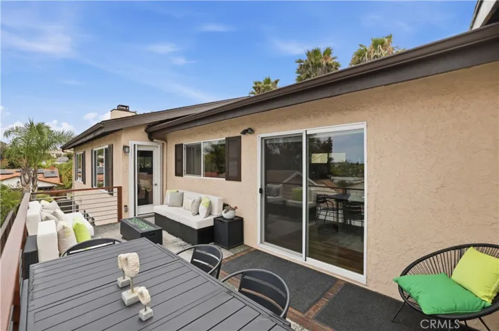 Dual access to the deck through the dining room or through the family room.