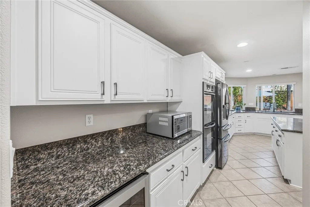 Spacious kitchen featuring granite countertops, and plenty of storage space. Spacious kitchen featuring granite countertops, and plenty of storage space.