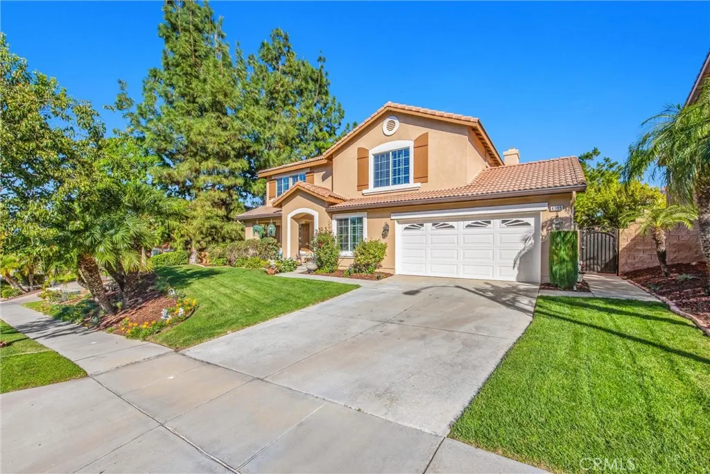 Beautiful two-story home with lush landscaping and inviting curb appeal. Beautiful two-story home with lush landscaping and inviting curb appeal.