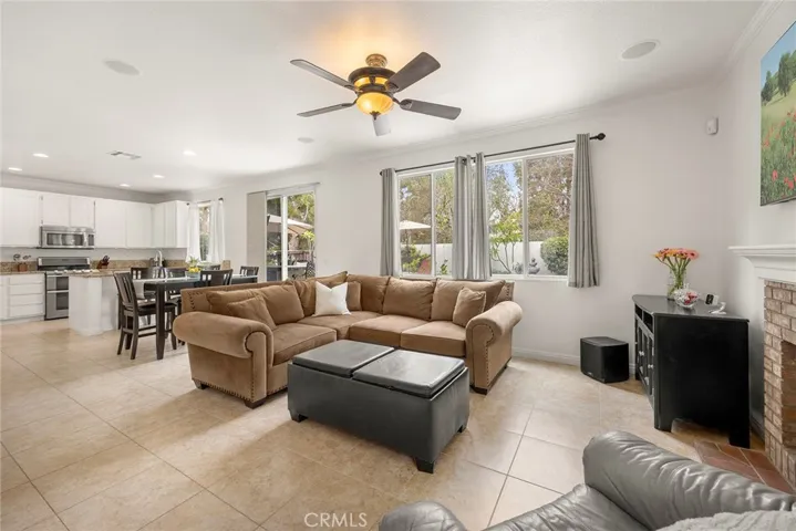 The open floor plan connects the living room, dining area, and kitchen, offering comfortable everyday living and an ideal space for entertaining.