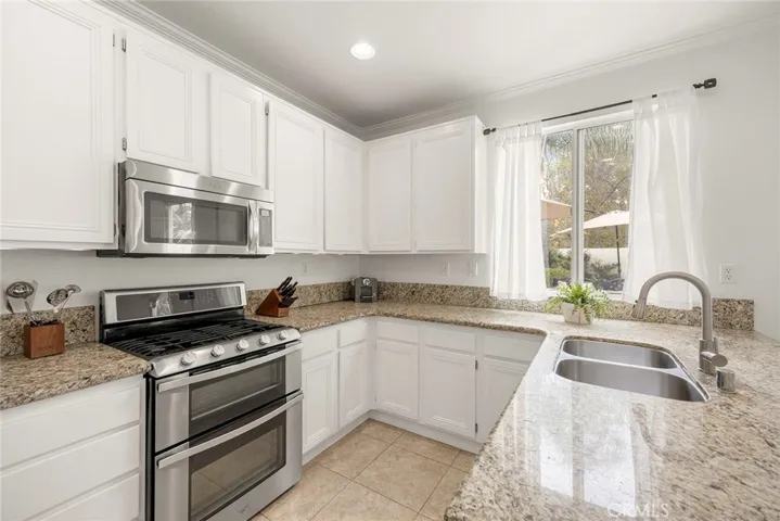 A wonderful opportunity to create the kitchen you've always envisioned. This clean slate is ready for your personal style and finishing touches, with stainless steel appliances including a gas range and oven already in place.