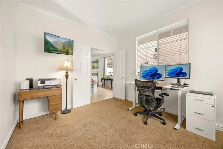 With its double-door entry and front-facing windows, this downstairs bedroom offers a bright, flexible space to suit your needs.