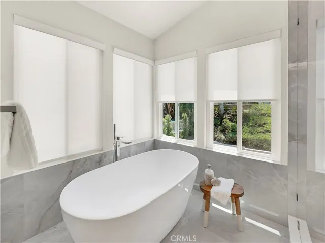 Stand-alone porcelain tub is perfect after a long day.