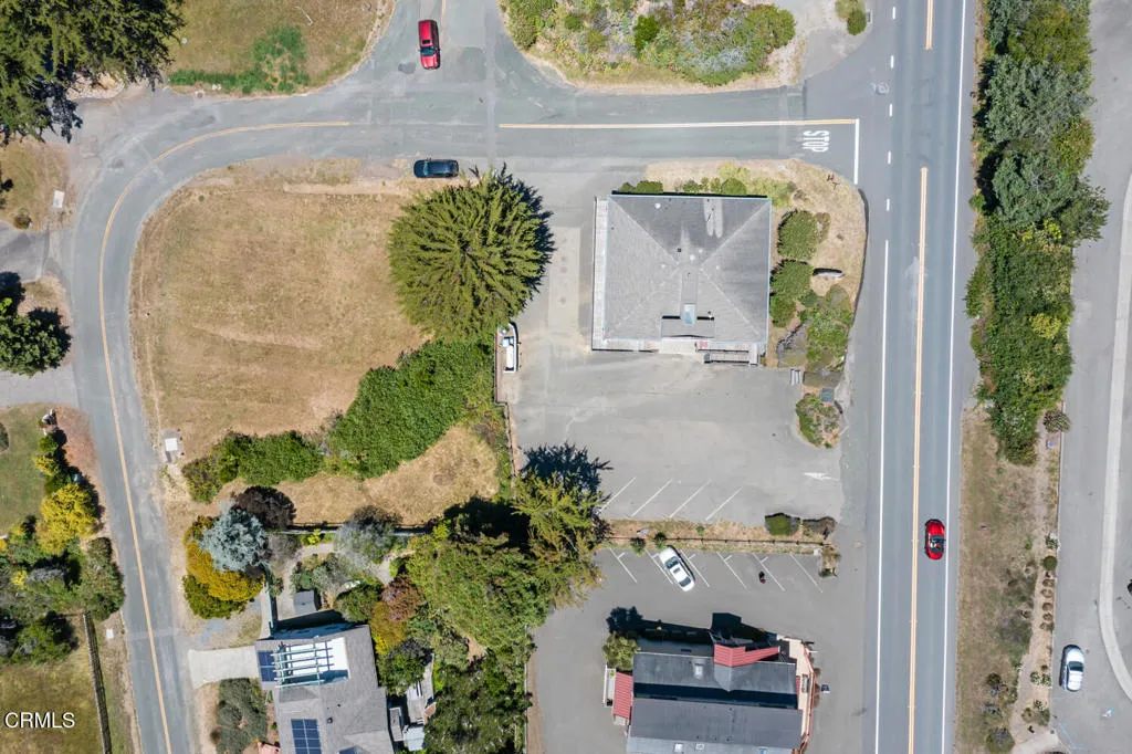 closer aerial view of lot & building