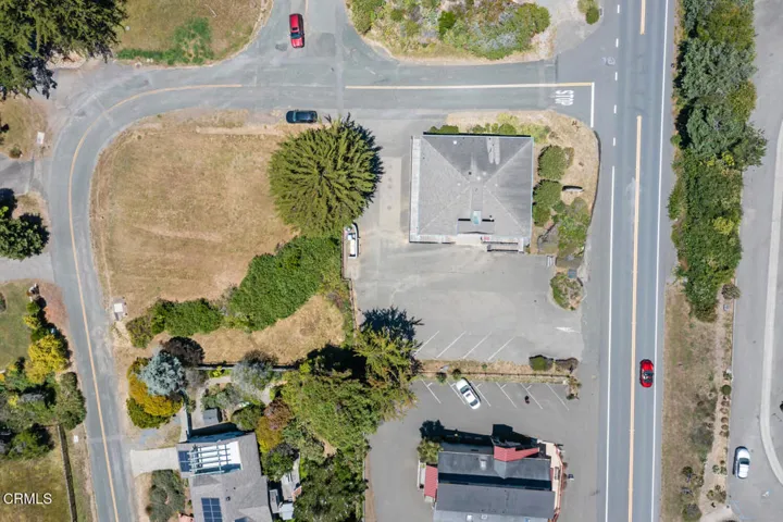 closer aerial view of lot & building
