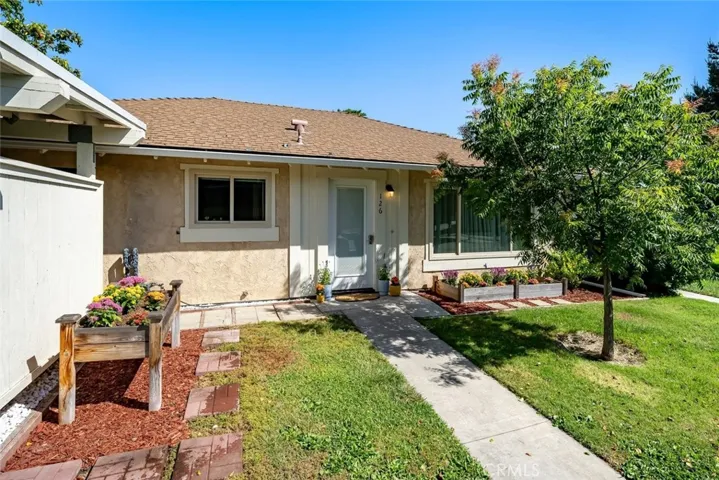 Front of house with garden beds