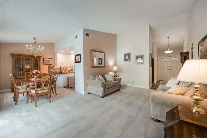 Living room offes open dining ell steps from updated kitchen