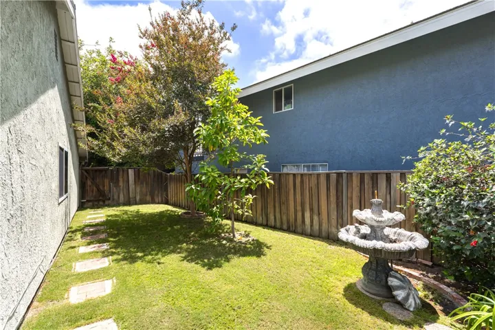 A grassy area large enough for pets or playtime