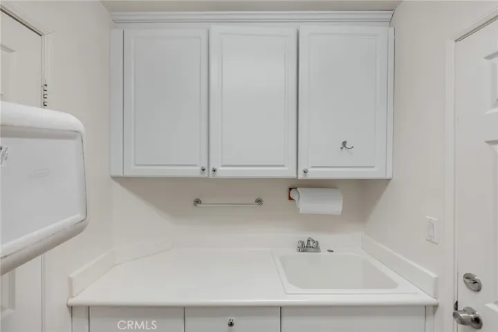 laundry sink and cabinets