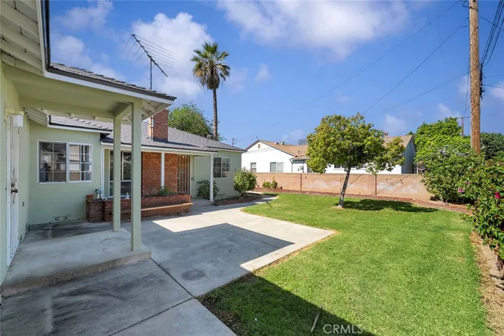 Large backyard with fruit trees and lots of room for kids to play.