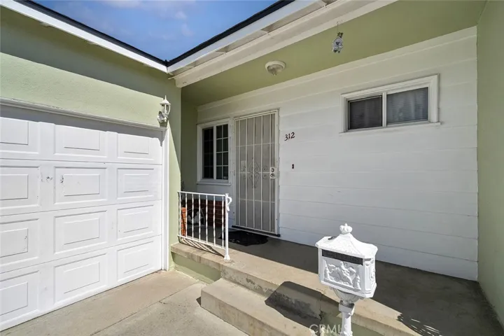 Large covered porch with fresh paint and new roof