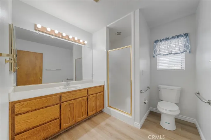 Large back bathroom with new flooring and new paint.