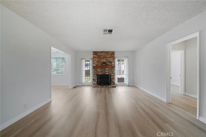 Spacious Living Room with all new paint and vinyl flooring